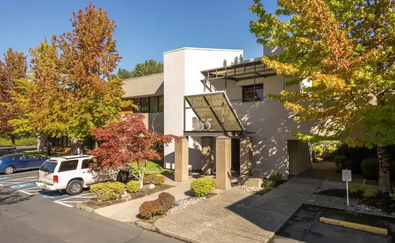 House driveway with a parking lot next to it